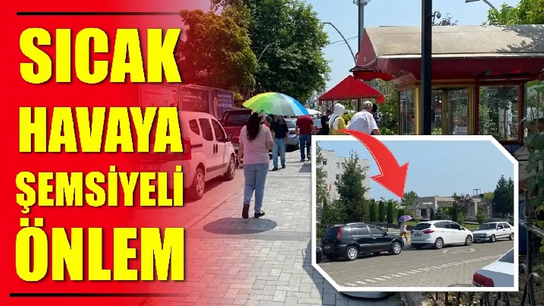 Şemsiye ile sıcaktan korundular