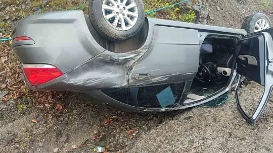 Takla atan otomobilden yara almadan kurtuldu