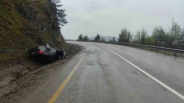 Takla atan otomobilden yara almadan kurtuldu