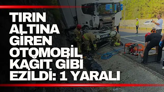 Tırın altına giren otomobil kağıt gibi ezildi: 1 yaralı